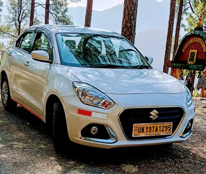 Maruti Suzuki Swift Dzire — white sedan